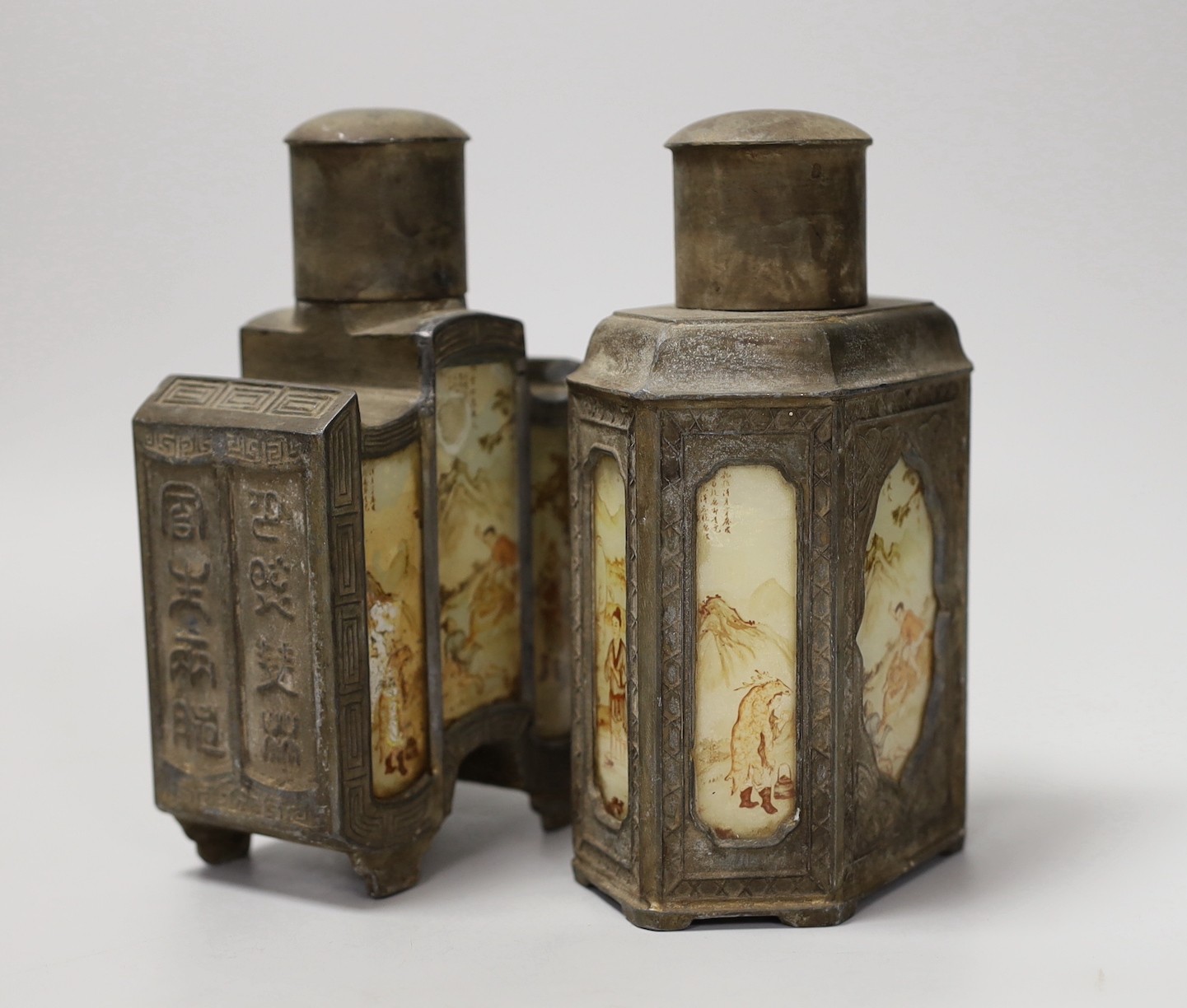 Two Chinese pewter tea caddies with glass panelled decoration. 18cm high